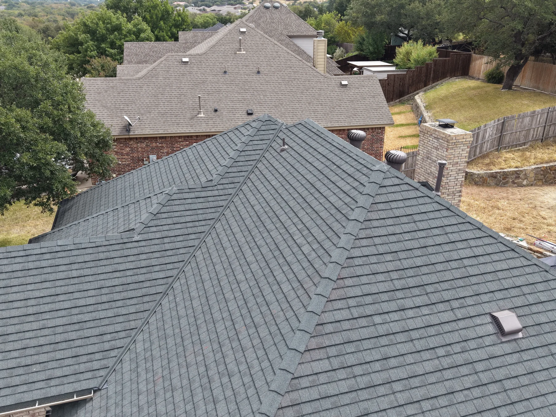 Slate Stormetal Shingle roof showing layered hip and ridge details